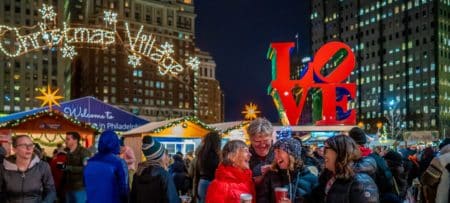people smiling, skyscrapers, night, lit up signs, lights