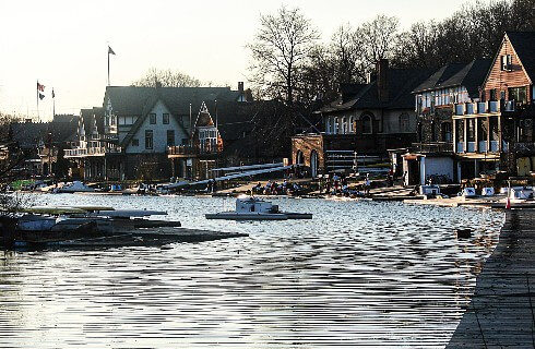 Row of homes and boat docks lining a narrow river